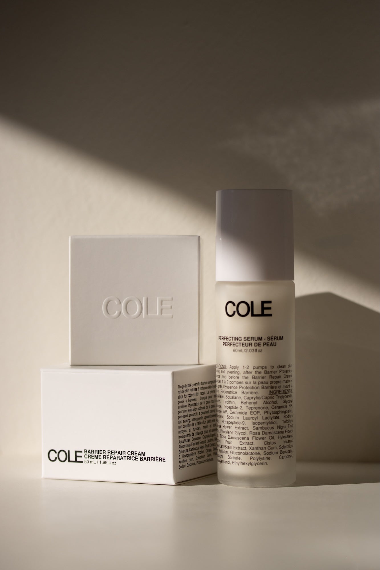 Cole skincare products on a neutral background