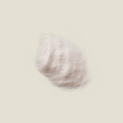 Round, textured object on a beige background