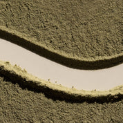 Close-up of a textured green surface with wavy patterns
